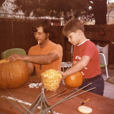 Richard and dad carving pumpkins 