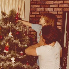 Every year from the time Amanda was a baby, you would lift her up to put the top ornament on our tree. You are such an awesome Dad...