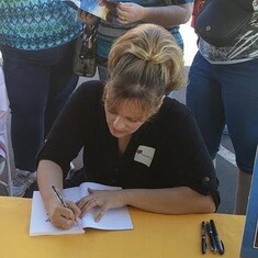 I wish you could have been there ~ Our beautiful daughter at her first book signing. 
We miss you and love you so much...