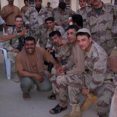 Lee is sitting in the white chair - This is some of the Iraqi soldiers the unit was training