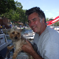 Dad with his little pal, Scooby, for the traditional July 4th boat parade at Sand Lake