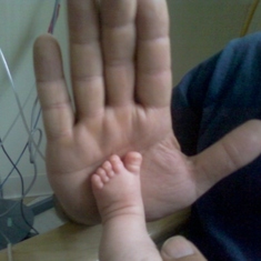 Gavin's little foot in daddy big hand