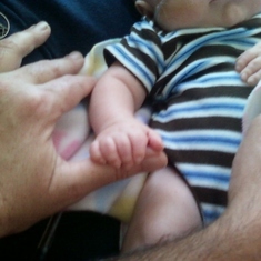 Gavin holding Grandmas thumb