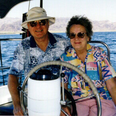 Dad & Mom on their 30 foot sailboat called Puffin