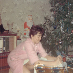 Mom opening Christmas gift New Westminster BC 1968