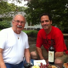 George and his son-in-law Andy. They're on the bocce court. George loved to drink red wine and play bocce.