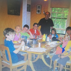 George serving breakfast to his grandchildren at the Round Lake Club, Upper Peninsula, Michigan 2005