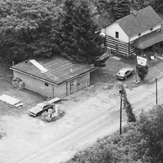 log house and gas station