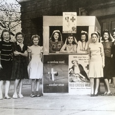 Helen, center in the Red Cross booth, in front of the Grand Opera house in Badin, NC