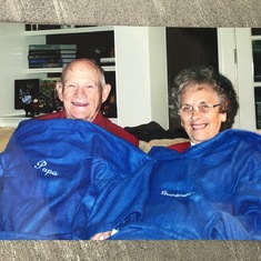 Papa and Gramommy under their Snuggie.