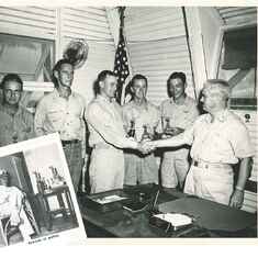 George, center, is congratulated as he wins another trophy. Photo insert shows George in his dress whites.