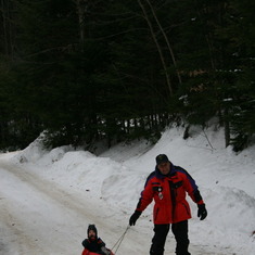 Papa & Vayle (or Dylan) sledding in Maine