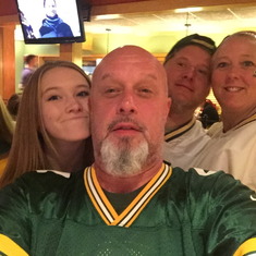 This pic was taken Thanksgiving night, 4 days after my fathers passing.  We are all wearing something Packers of my Dads in this pic.  Unfortunately the Pack did not pull it off but we still were all so proud having a part of him with us during the game.