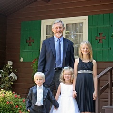 George and his grandkids, Cole, Madison, and McKinzie, and his daughter's wedding.