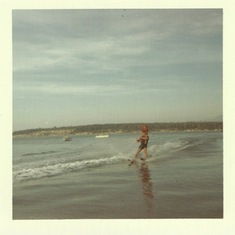 George waterskiing with 4yo nephew on his shoulders