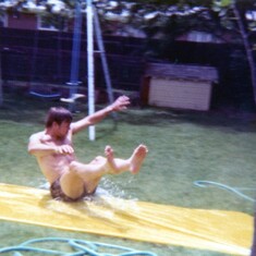 Dad showing us how its done on the "slip and slide!"