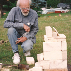 Gerry firing the portable kiln, 1994