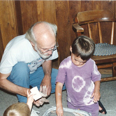 Gerry teaching Dan and Nita Englund how to throw pots, 1994