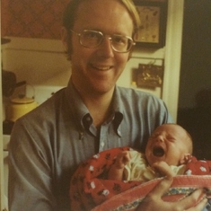 Holding new baby David, 1977