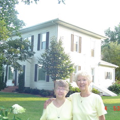 Virginia Thompson Baudrand and Connie Thomson Owens in front of Grandma and Grandpa Stevens home in Albion, Iowa.
