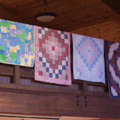 Quilts made by Ginny for her grandchildren and great-grandchildren