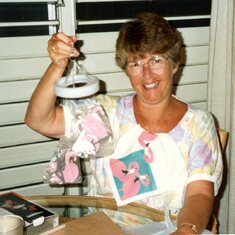 Mom with secret friend flamingo gifts.