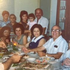 1972 (second from left at table, wearing green)