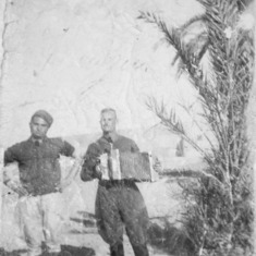 Giuseppe Torcasio: playing a diatonic button accordion which he used to entertain the soldiers. WWII North Africa.