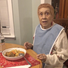 Mom on her 89th birthday enjoying one of her favorite meals, Sancocho.