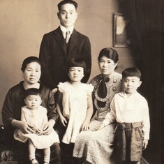 1939.  Formal family portrait of the Tom Kumasaka family in Tacoma Washington