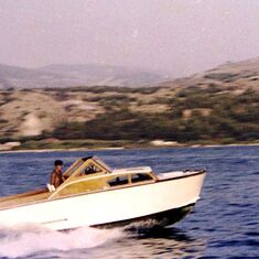 I am at the helm of "Ketty. M", in the harbour of Argostoli, Kefalonia, Greece in the summer of 1966
