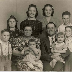 The Knudsen Family.  Glenna is the girl on the left with the bow in her hair.