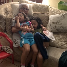 Grandma loving on her youngest grandchildren