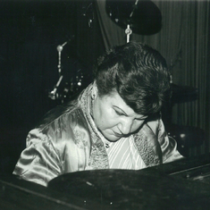 Gloria playing piano