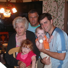 Gloria, with Son Chris, Grandson Terence, and Great Grandkids McKenzie and Ainsley.