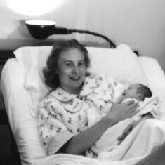 Grace holding her first child Debra