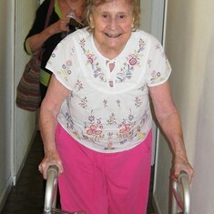 Amazing Grace walking down the hallway at Britannia Lodge on her 92nd birthday (with Mary Bazant in the background) - July 13, 2015