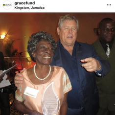 Butch Stewart and Auntie Grace  receiving an award