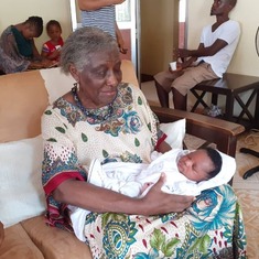With grandson Roxy, Kevin, Prosper Morquee, on his naming ceremony.