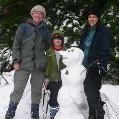 Family snowshoe and snowman