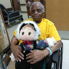 Holding a stuffed doll from her granddaughter Candace Butler