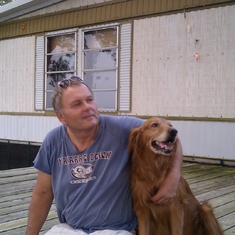 Greg on his back porch, with his neighbor's dog "Buddy", enjoying the view of Escambia Bay.