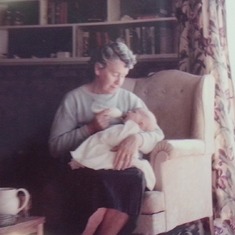 Greg being held by his paternal grandmother.