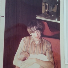 Greg holding his nephew Mathew.