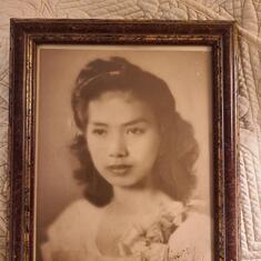 Mom when she was younger.  It says "Sincerely, Nena"