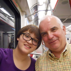 They were having fun riding a subway! A fun loving father.