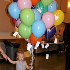 Little Miss Charlie held on to the balloon bundle before the Release Celebration