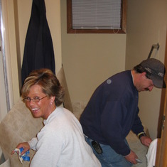 Laying new flooring in the bathroom of the soon to be occupied house on Willow - Feb 10, 2005