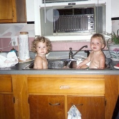 Halie Bathing in the Sink with Cousin Taylor