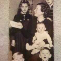 The Beckers during WWII with their mother Anna Maria. Hans is the boy standing behind his mother.